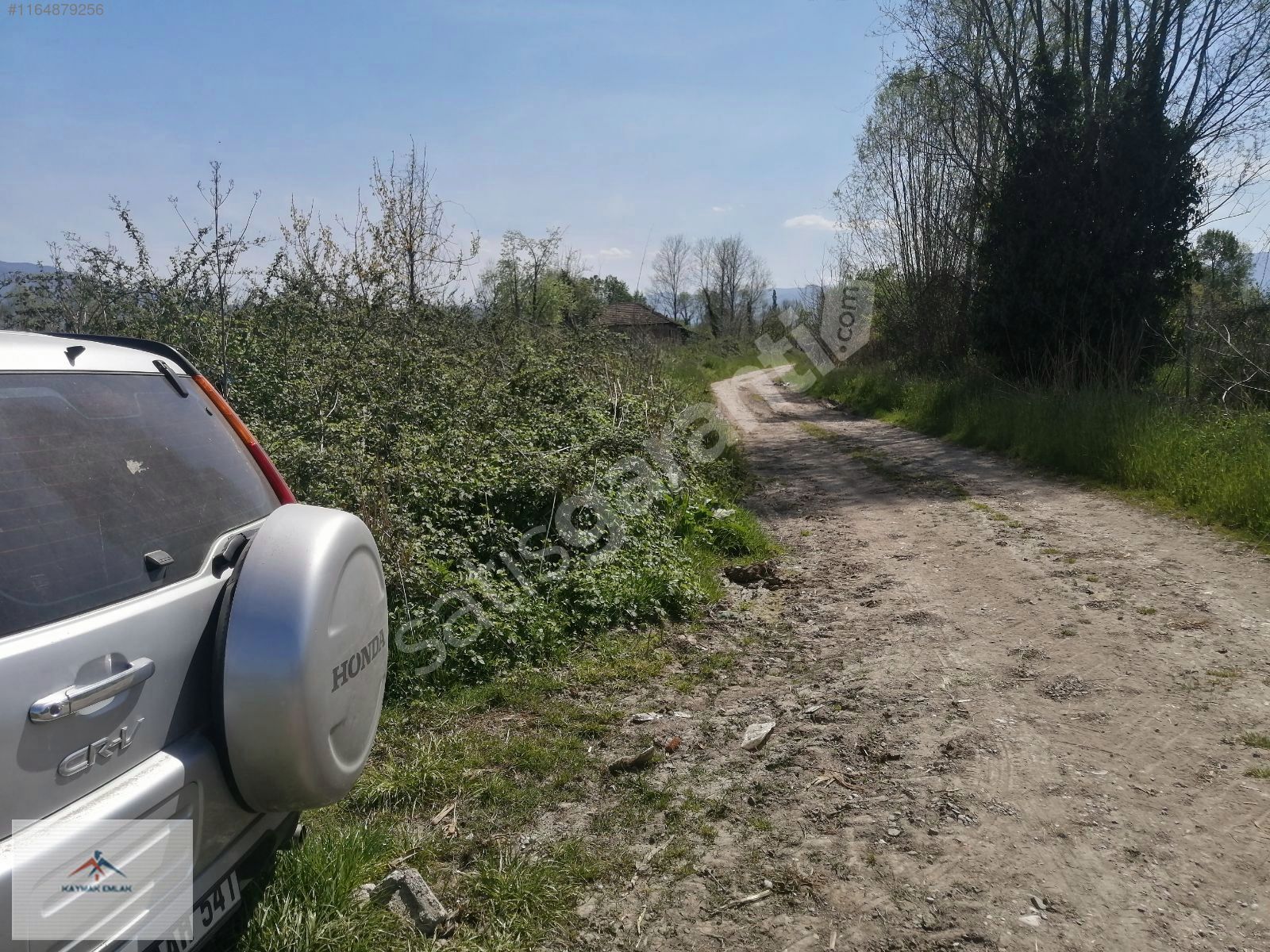 Elektrik suya yakın resmi yolu olan Satılık arazi