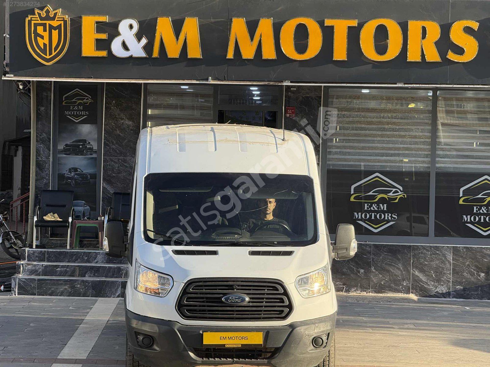 E&M MOTORS TAN